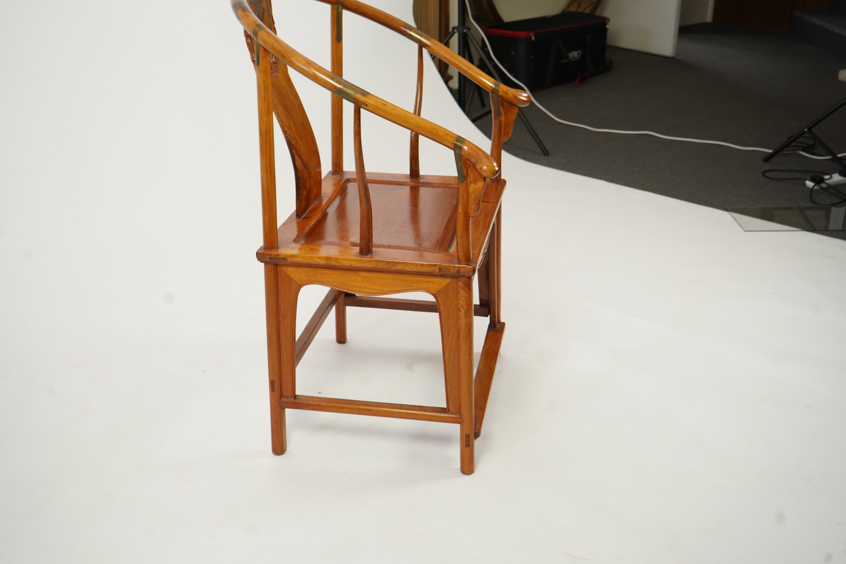A Chinese huanghuali and brass mounted horseshoe-back armchair, quanyi, late 19th century